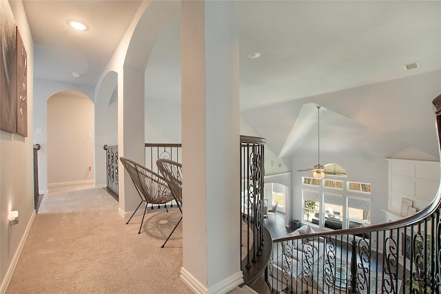 1121 Red Hawk Ln, Forney, TX 75126 - hall with arched walkways, carpet floors, baseboards, vaulted ceiling, and an upstairs landing