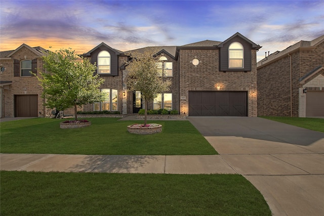 1121 Red Hawk Ln, Forney, TX 75126 - view of front of property featuring concrete driveway, a front yard, brick siding, and a garage