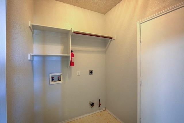 3331 Midstream Ct, Mesquite, TX 75181 - laundry area featuring gas dryer hookup, washer hookup, electric dryer hookup, baseboards, and a textured ceiling