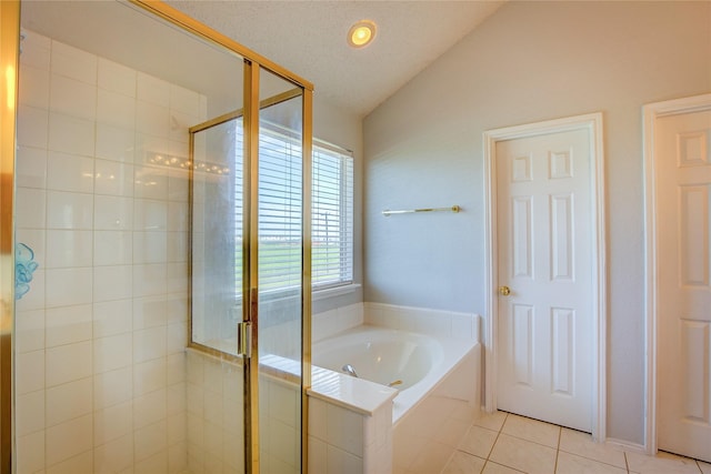 3331 Midstream Ct, Mesquite, TX 75181 - full bathroom with vaulted ceiling, a bath, tile patterned floors, and a stall shower