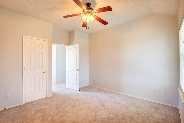 3331 Midstream Ct, Mesquite, TX 75181 - unfurnished bedroom with light carpet, lofted ceiling, a textured ceiling, baseboards, and a ceiling fan