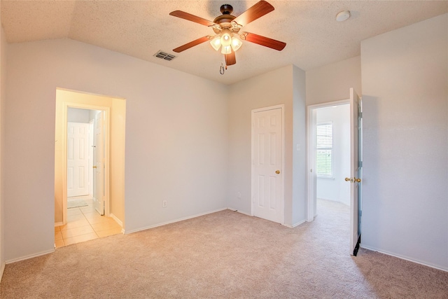 3331 Midstream Ct, Mesquite, TX 75181 - unfurnished bedroom with light colored carpet, vaulted ceiling, baseboards, a ceiling fan, and a textured ceiling