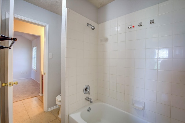 3331 Midstream Ct, Mesquite, TX 75181 - bathroom featuring toilet, shower / bath combination, tile patterned flooring, and a textured ceiling