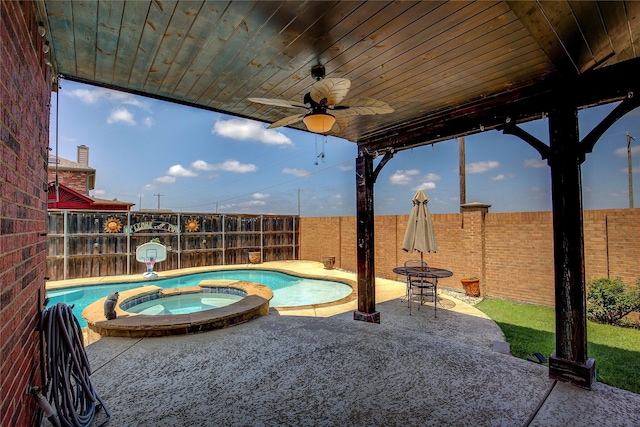 3331 Midstream Ct, Mesquite, TX 75181 - fenced backyard with a ceiling fan, a patio area, and a pool with connected hot tub