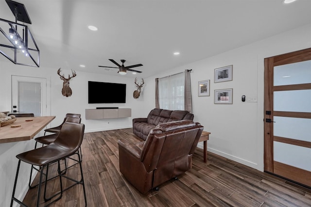living room with baseboards, ceiling fan, recessed lighting, and dark wood-style flooring
