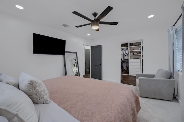 bedroom featuring a closet, a ceiling fan, baseboards, visible vents, and recessed lighting