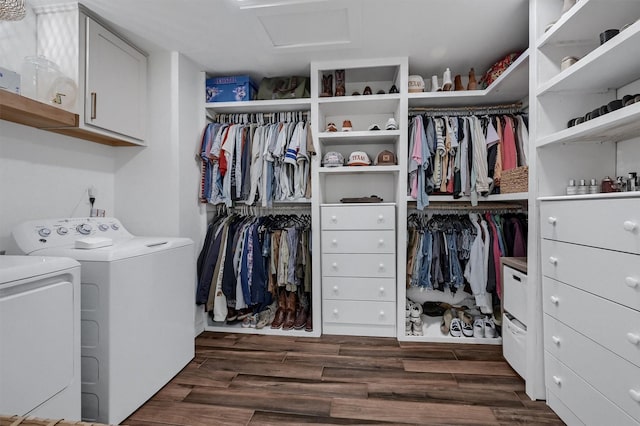 spacious closet with washing machine and clothes dryer, dark wood-style floors, and attic access