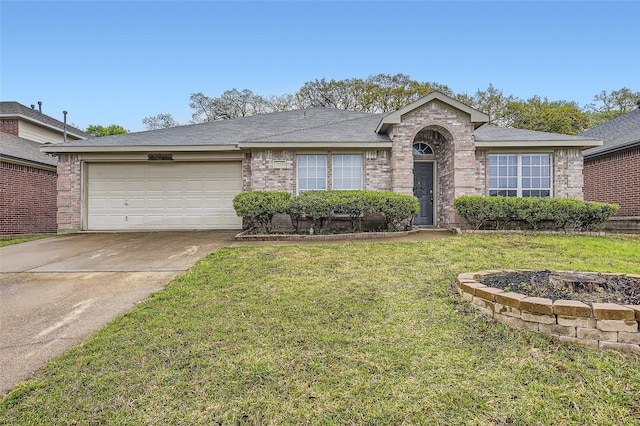 single story home with concrete driveway, a front yard, brick siding, and an attached garage