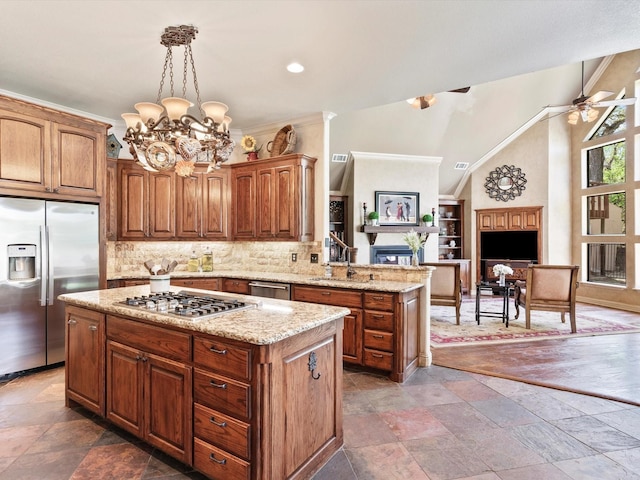 9 Eagle Pt N Unit A, Azle, TX 76020 - kitchen featuring appliances with stainless steel finishes, a fireplace, a sink, a center island, and a chandelier