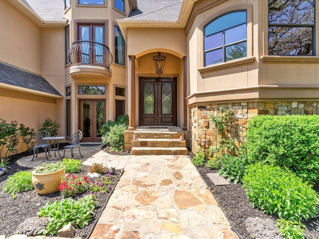 9 Eagle Pt N Unit A, Azle, TX 76020 - property entrance featuring french doors, stucco siding, a balcony, and stone siding