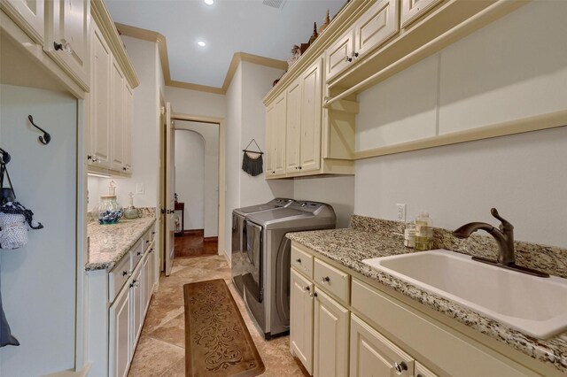 7545 Colton Ln, Pilot Point, TX 76258 - washroom featuring cabinet space, washing machine and dryer, recessed lighting, and ornamental molding