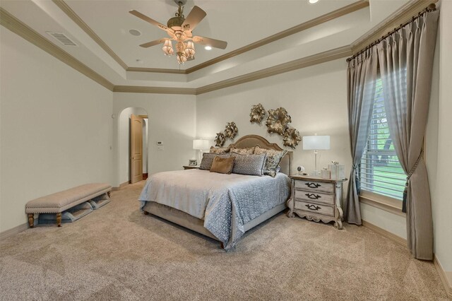 7545 Colton Ln, Pilot Point, TX 76258 - bedroom featuring carpet floors, ornamental molding, a tray ceiling, arched walkways, and baseboards