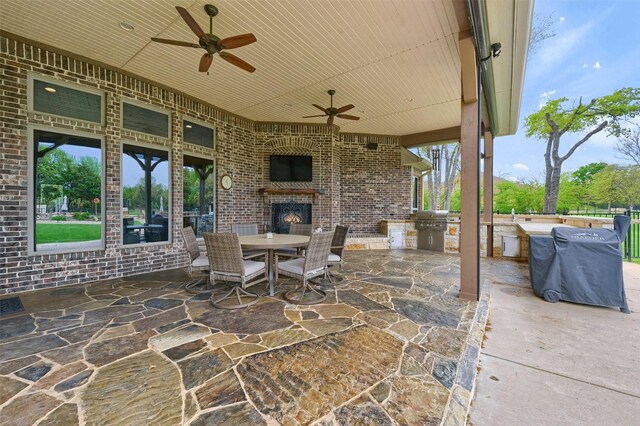 7545 Colton Ln, Pilot Point, TX 76258 - view of patio / terrace featuring an outdoor brick fireplace, a ceiling fan, and outdoor dining area