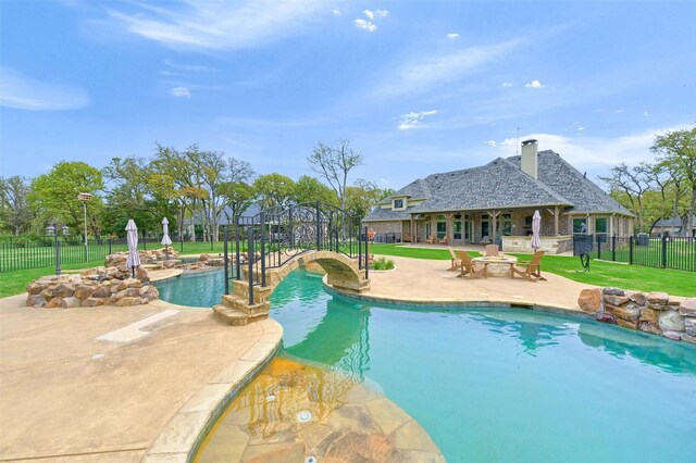 7545 Colton Ln, Pilot Point, TX 76258 - view of pool featuring a patio area and a fire pit