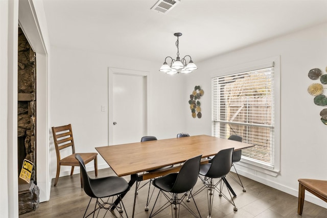 1018 Brookhollow Dr, Irving, TX 75061 - dining area featuring baseboards, a chandelier, and wood finished floors