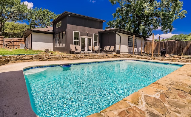1018 Brookhollow Dr, Irving, TX 75061 - view of pool featuring a patio, a fenced backyard, and french doors