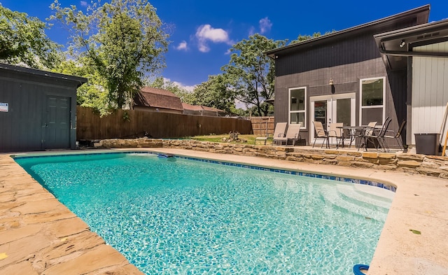 1018 Brookhollow Dr, Irving, TX 75061 - view of swimming pool featuring a fenced backyard, a patio area, and french doors