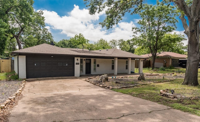 1018 Brookhollow Dr, Irving, TX 75061 - ranch-style house featuring brick siding, an attached garage, concrete driveway, a shingled roof, and fence
