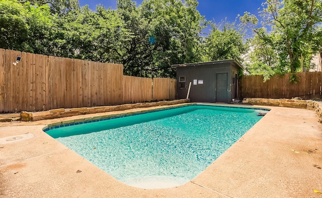 1018 Brookhollow Dr, Irving, TX 75061 - view of pool with a fenced backyard, an outdoor structure, a patio, and a shed