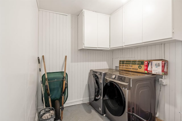 1018 Brookhollow Dr, Irving, TX 75061 - laundry room with cabinet space, independent washer and dryer, and wooden walls