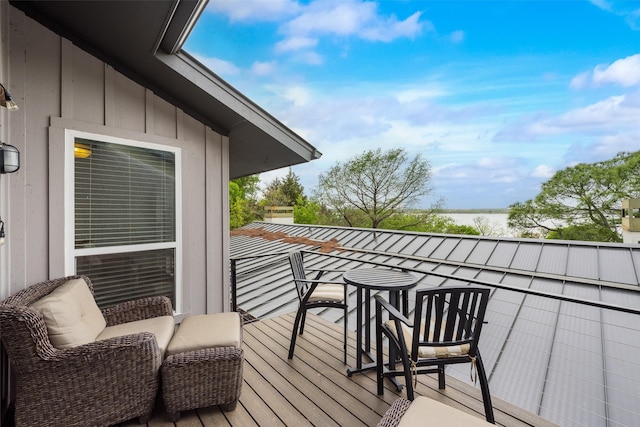 balcony featuring a water view