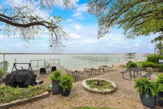 view of water feature with a dock