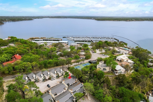 birds eye view of property with a water view