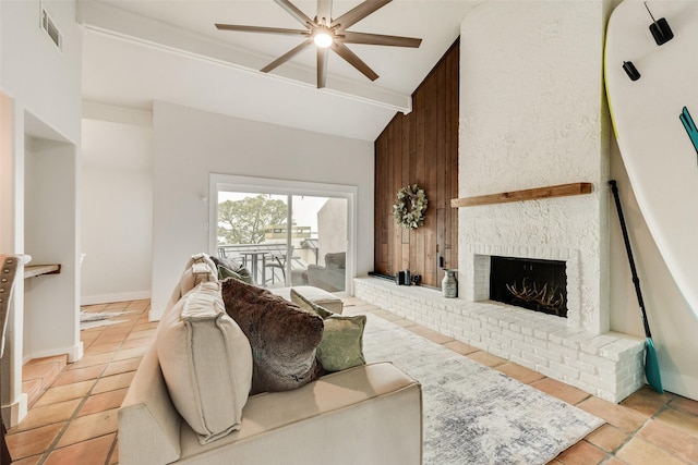 living room featuring high vaulted ceiling, baseboards, visible vents, a ceiling fan, and a fireplace