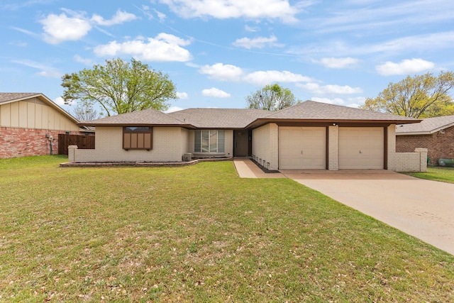 view of front of property with an attached garage, concrete driveway, brick siding, and a front yard