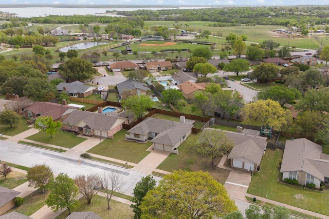 bird's eye view with a water view and a residential view