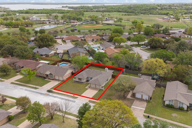 aerial view with a residential view and a water view