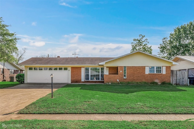 1806 Ray Ave, Bossier City, LA 71112 - ranch-style house with brick siding, a front yard, an attached garage, and driveway