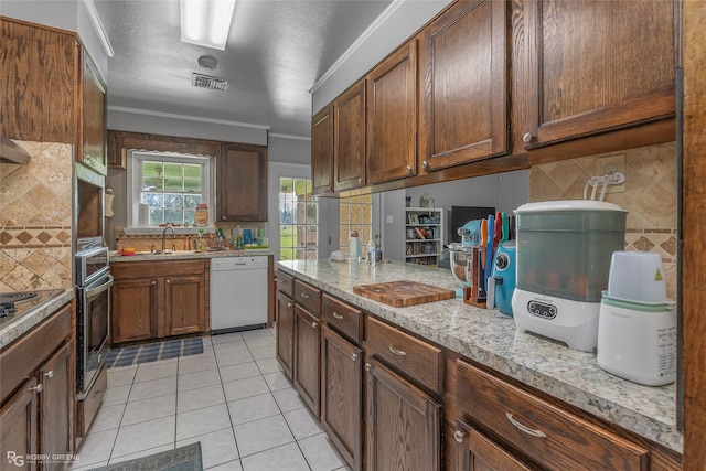 1806 Ray Ave, Bossier City, LA 71112 - kitchen featuring light tile patterned floors, stainless steel oven, tasteful backsplash, visible vents, and dishwasher