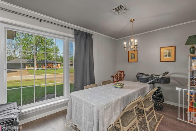 1806 Ray Ave, Bossier City, LA 71112 - dining room featuring dark wood finished floors, ornamental molding, visible vents, a chandelier, and baseboards