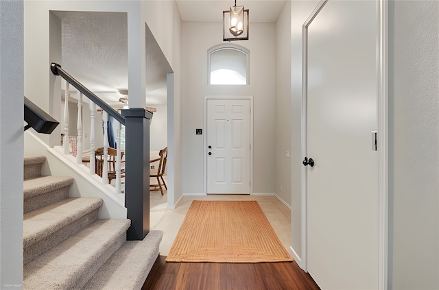 5501 Whisper Glen Dr, Arlington, TX 76017 - entryway with stairs and wood finished floors