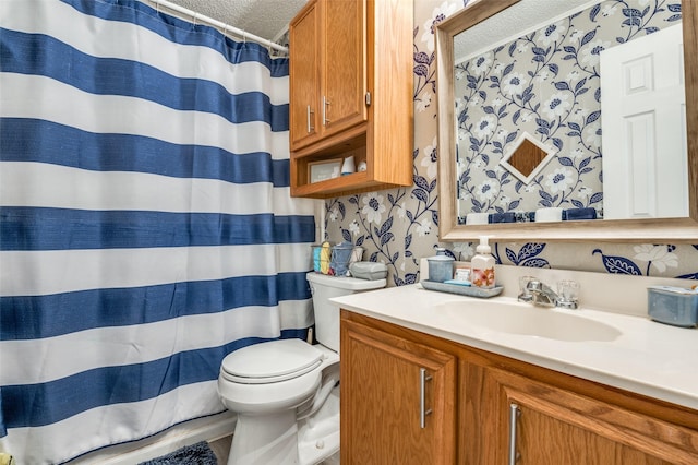 full bathroom featuring vanity, wallpapered walls, curtained shower, a textured ceiling, and toilet