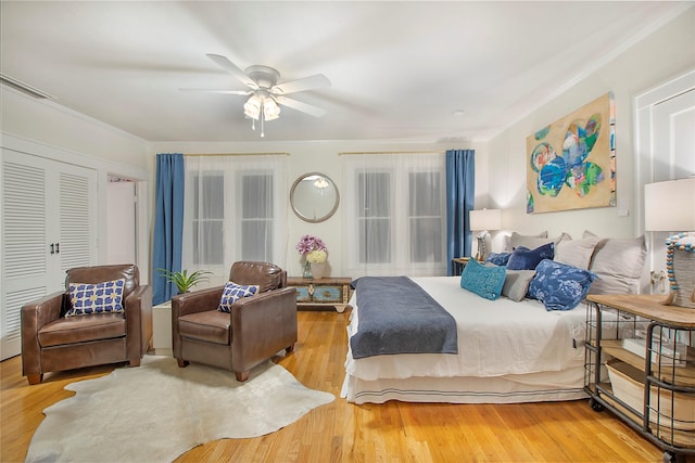 bedroom with ceiling fan and wood finished floors