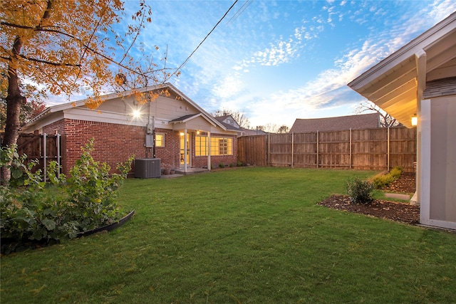 view of yard with cooling unit and a fenced backyard