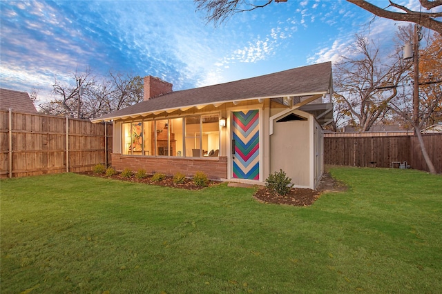 view of outbuilding featuring a fenced backyard