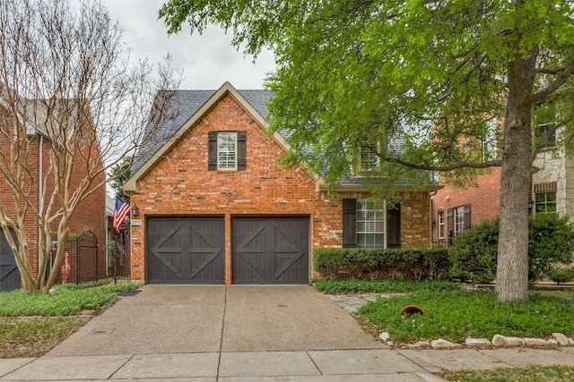 2212 Stone Creek Dr, Mckinney, TX 75072 - view of front of house featuring concrete driveway, brick siding, a garage, and roof with shingles