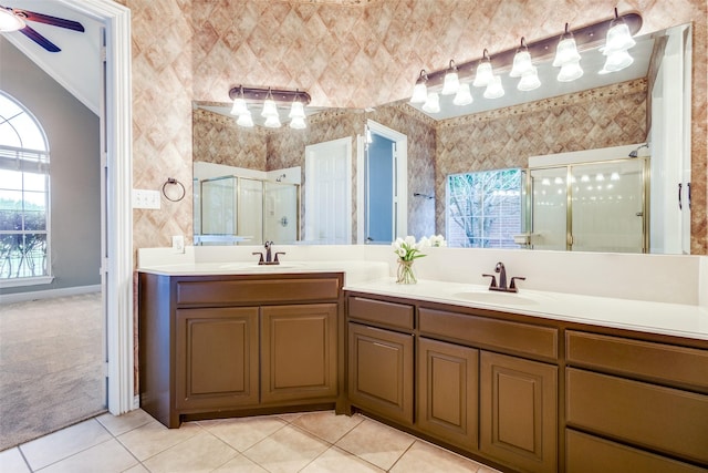 2212 Stone Creek Dr, Mckinney, TX 75072 - bathroom featuring double vanity, a stall shower, tile patterned floors, crown molding, and ceiling fan
