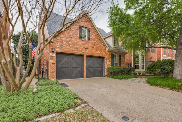 2212 Stone Creek Dr, Mckinney, TX 75072 - traditional home with brick siding, driveway, an attached garage, and a shingled roof