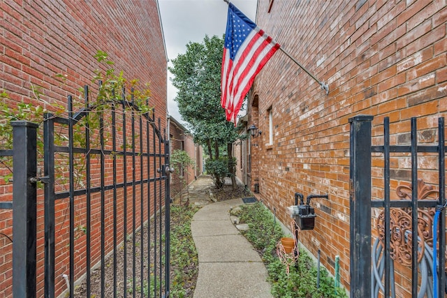 2212 Stone Creek Dr, Mckinney, TX 75072 - view of property exterior featuring a gate and brick siding