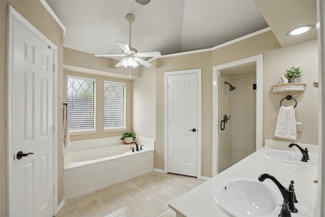 2002 Thames Dr, Arlington, TX 76017 - full bathroom with a bath, a ceiling fan, tile patterned floors, a stall shower, and double vanity