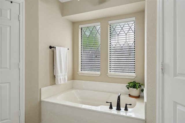 2002 Thames Dr, Arlington, TX 76017 - bathroom featuring a garden tub
