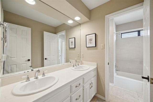 2002 Thames Dr, Arlington, TX 76017 - full bath with double vanity and tub / shower combination