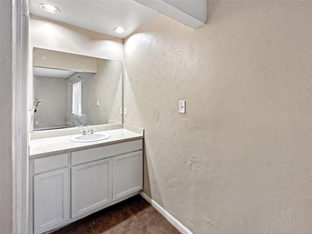 411 Mckinley St, Cedar Hill, TX 75104 - bathroom with vanity, baseboards, and a textured wall