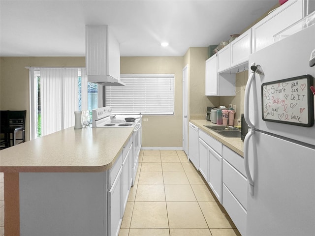 411 Mckinley St, Cedar Hill, TX 75104 - kitchen featuring white appliances, light tile patterned floors, white cabinetry, light countertops, and a sink
