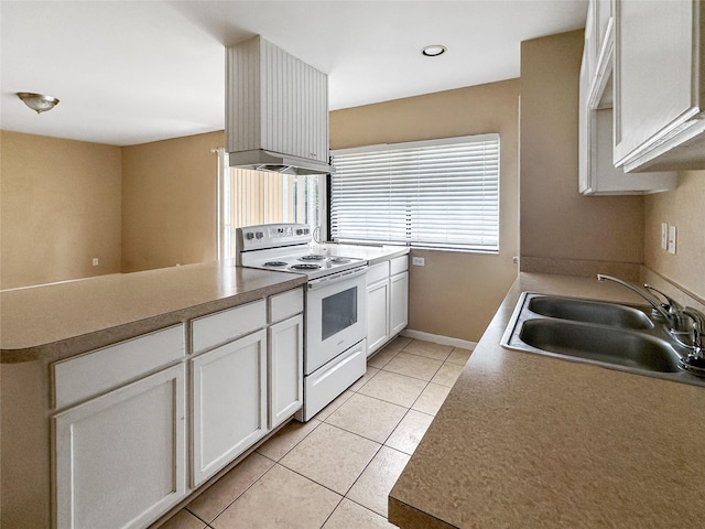 411 Mckinley St, Cedar Hill, TX 75104 - kitchen featuring white range with electric cooktop, a sink, light tile patterned flooring, a peninsula, and white cabinetry