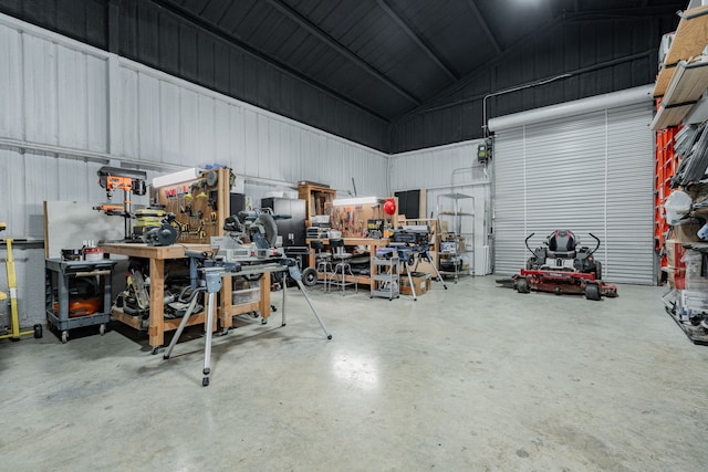 garage with metal wall and a workshop area